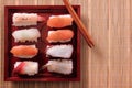 Tray assorted sushi chopsticks top view takeaway japanese food Royalty Free Stock Photo