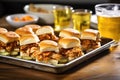 tray of bbq sliders with side of potato chips