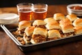 tray of bbq sliders with side of potato chips