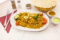 Tray of biryani rice stewed with lamb meat and vegetables cooked