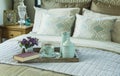 Tray with book,tea set and flower on the bed Royalty Free Stock Photo