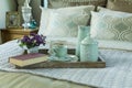 Tray with book,tea set and flower on the bed Royalty Free Stock Photo