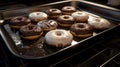 a tray of chocolate covered donuts in a pan