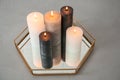 Tray with decorative wax candles Royalty Free Stock Photo