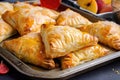 a tray of flaky puff pastry turnovers, filled with fruit and spices Royalty Free Stock Photo