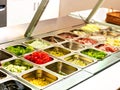 Tray with food on showcase at cafeteria Royalty Free Stock Photo