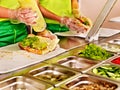 Tray with food on showcase at cafeteria Royalty Free Stock Photo