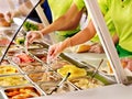 Tray with food on showcase at cafeteria Royalty Free Stock Photo