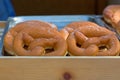 Tray of fresh soft and sweet Pretzel dusted with sugar