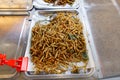 A tray of fried insects is on a table Royalty Free Stock Photo