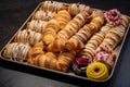a tray full of assorted danish pastries