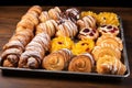 a tray full of assorted danish pastries