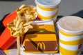 tray full of fast food in McDonalds Restaurant, Big Mac Menu with McDonalds logo box, Cheeseburger, French fries, Cola