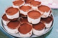 Tray full of individual tiramisu desserts