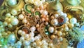 Tray of glassy, brassy, jewels and baubles shine