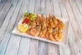 Tray of great grilled fried prawns with spurts of lemon, garlic and parsley,