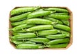 Cardboard punnet with fresh pea pods, containing green peas Royalty Free Stock Photo