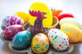 Hand painted eggs on a tray for easter with a hen Royalty Free Stock Photo