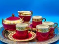 a tray holding several colorful colored tea cups and saucers Royalty Free Stock Photo