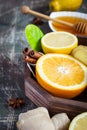 Tray with ingredients for making immunity boosting healthy vitamin drink On dark background Royalty Free Stock Photo