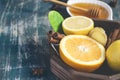 Tray with ingredients for making immunity boosting healthy vitamin drink On dark background Royalty Free Stock Photo