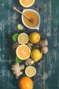 Tray with ingredients for making immunity boosting healthy vitamin drink On dark turquoise background Royalty Free Stock Photo