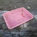 A tray made of pink plastic