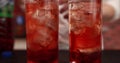 Red drinks are delivered by a waiter Royalty Free Stock Photo
