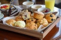 a tray of muffins and scones, daintily arranged for morning tea Royalty Free Stock Photo