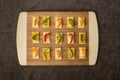 Tray of neatly arranged snacks on crackers Royalty Free Stock Photo