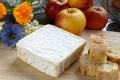 Tray with pont eveque cheese with bread and apples