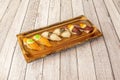 Tray with portions of nigiri sushi assorted butterfish with black truffle, Norwegian salmon with green fish roe Royalty Free Stock Photo