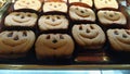 Tray of pumpkin-shaped biscuits in pastry and cocoa, ready for the Halloween party Royalty Free Stock Photo