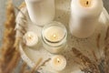 Tray with scented candles and reed on gray table Royalty Free Stock Photo