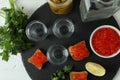 Tray with shots of vodka and tasty snacks, top view Royalty Free Stock Photo