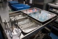 a tray of surgical instruments being sterilized in a medical laboratory