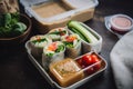 A tray of sushi rolls and a bowl of dipping sauce. AI generative image. Royalty Free Stock Photo