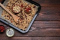 Tray with tasty granola, nuts and dry fruits on wooden table, flat lay. Space for text