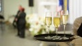 A tray with three glasses of champagne. Waiter holding a tray with a champagne glass Royalty Free Stock Photo