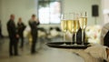 A tray with three glasses of champagne. Waiter holding a tray with a champagne glass Royalty Free Stock Photo