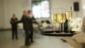 A tray with three glasses of champagne. Waiter holding a tray with a champagne glass Royalty Free Stock Photo