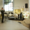 A tray with three glasses of champagne. Waiter holding a tray with a champagne glass Royalty Free Stock Photo