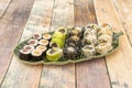 Tray of uramaki and assorted maki with black rice and butterfish uramaki Royalty Free Stock Photo