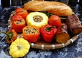 Tray of vegan meal with grilled tomato, bell peppers,  pumpkin, sweet potato and bread Royalty Free Stock Photo