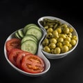 trays with appetizers, pickles, olives, tomato and cucumber, vegetarian diet