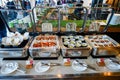 The trays contain buffet food at a restaurant