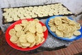 Trays filled with flat sticky rice cakes dry in the sun in Luang Prabang, Laos Royalty Free Stock Photo