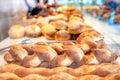 Trays of freshly baked artisan bread loaves at the food market Royalty Free Stock Photo