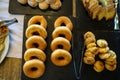 Trays of sweet baked dessert including donuts, cookies, butter cake, buns, etc. on Greek breakfast buffet table Royalty Free Stock Photo