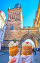 Trdelnik spit cake with cream and toppings in Prague, Czechia